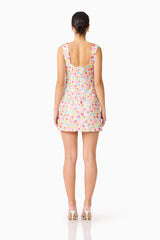 Brunette model wearing the CURAAE Bijou Mini Dress in Multi back shot