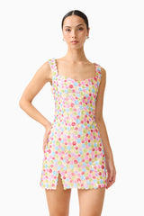Brunette model wearing the CURAAE Bijou Mini Dress in Multi posed shot