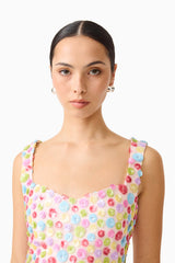 Brunette model wearing the CURAAE Bijou Mini Dress in Multi close up shot