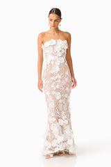 model wearing Tiana Floral Maxi Dress in Ivory posed looking down shot