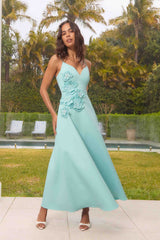 Brunette model wearing the Stella A-Line Gown in Aqua Blue campaign shot 