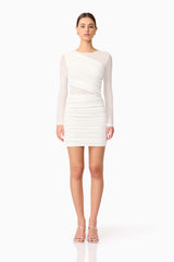 Brunette model wearing Darya Long Sleeve Mini Dress in White front shot