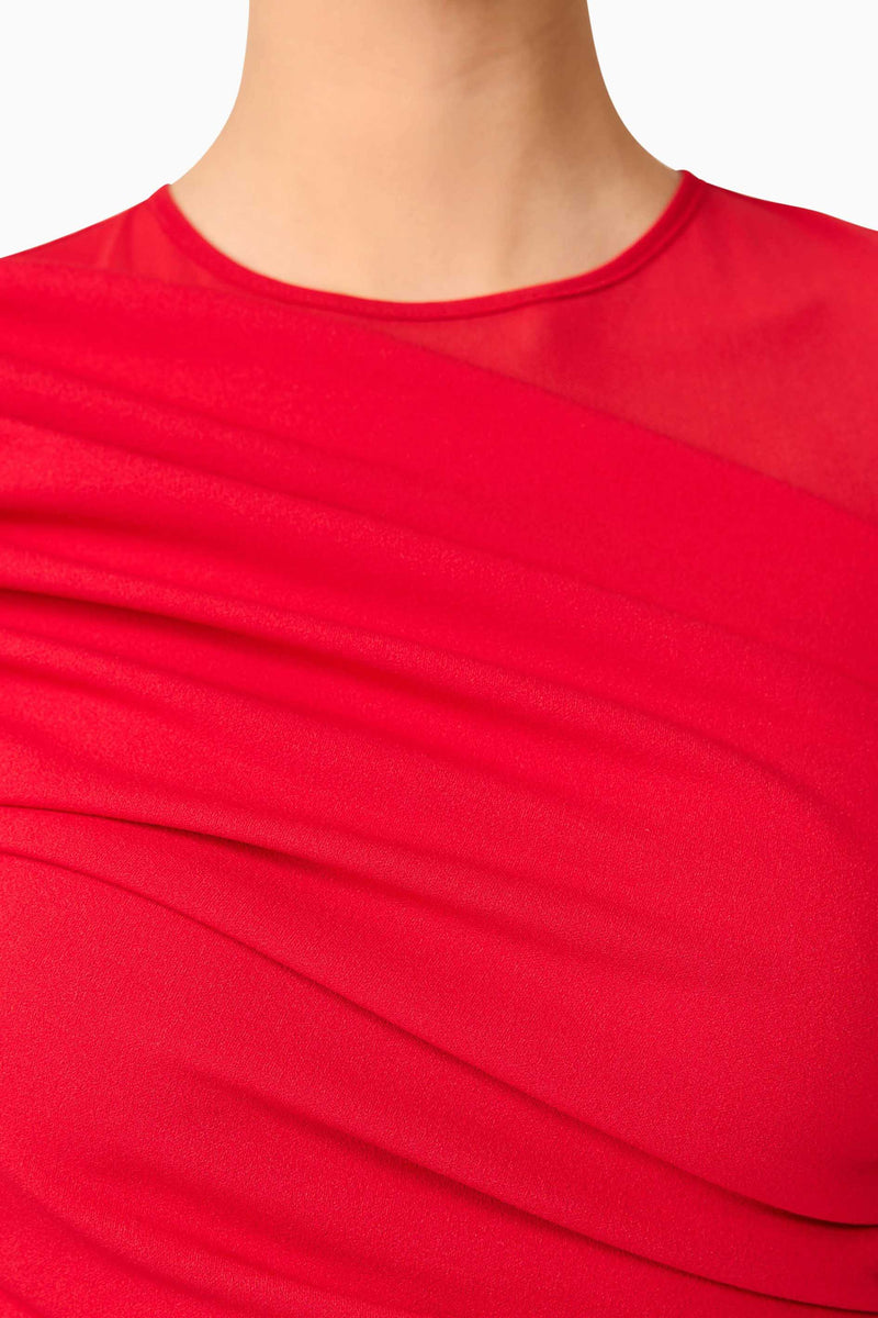 Brunette model wearing Darya Long Sleeve Mini Dress in Red detail shot