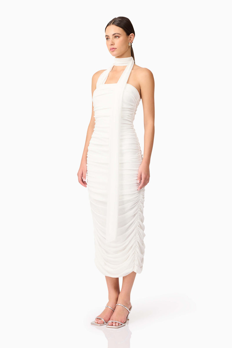 Brunette model wearing Darya Fitted Midi Dress in White side shot