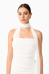 Brunette model wearing Darya Fitted Midi Dress in White close up shot