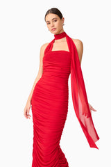 Brunette model wearing Darya Asymmetrical Gown in Red close up shot