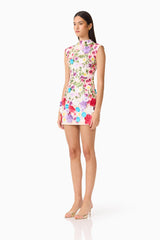 Brunette Model Wearing Rosette Sleeveless Mini Dress in Multi Floral Side Shot