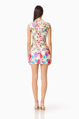 Brunette Model Wearing Rosette Sleeveless Mini Dress in Multi Floral Back Shot