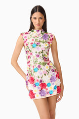 Brunette Model Wearing Rosette Sleeveless Mini Dress in Multi Floral Posed Medium Shot