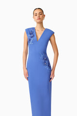 Brunette model wearing the Talitha Column Maxi Dress in Cornflower Blue close up shot