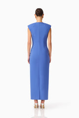 Brunette model wearing the Talitha Column Maxi Dress in Cornflower Blue back shot