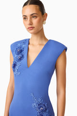 Brunette model wearing the Talitha Column Maxi Dress in Cornflower Blue close up shot