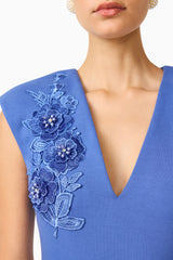 Brunette model wearing the Talitha Column Maxi Dress in Cornflower Blue detail shot