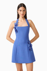 Brunette model wearing the Talitha Halter Mini Dress in Cornflower Blue close up shot