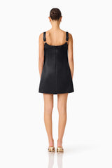 Brunette Model wearing Lucetta Shift Mini Dress in Black back shot