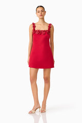 Brunette Model wearing Lucetta Shift Mini Dress in Red posed turned foot shot