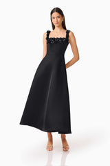 Brunette Model wearing the Lucetta Fit & Flare Midi Dress in Black posed hand behind shot
