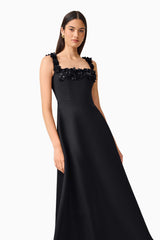 Brunette Model wearing the Lucetta Fit & Flare Midi Dress in Black posed leaning shot