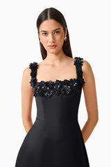 Brunette Model wearing the Lucetta Fit & Flare Midi Dress in Black close up shot