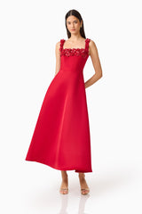 Brunette Model wearing the Lucetta Fit & Flare Midi Dress in Red posed hand behind shot
