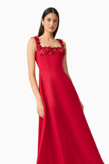 Brunette Model wearing the Lucetta Fit & Flare Midi Dress in Red posed leaning shot