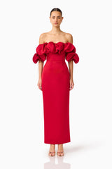 Brunette model wearing the  Lucetta Off Shoulder Gown in Red front shot