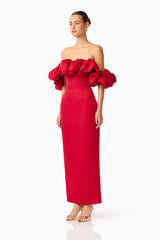 Brunette model wearing the  Lucetta Off Shoulder Gown in Red side shot
