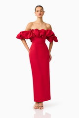 Brunette model wearing the Lucetta Off Shoulder Gown in Red posed hands on hip shot