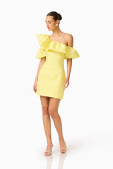 Brunette Model wearing the Luella One Shoulder Mini Dress in Yellow posed head turn shot