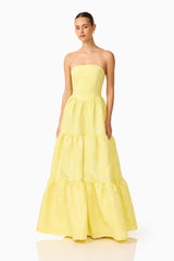 Brunette Model wearing the Luella Strapless Gown in Yellow posed shot