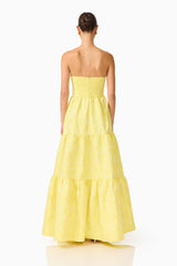 Brunette Model wearing the Luella Strapless Gown in Yellow back shot