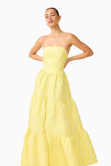 Brunette Model wearing the Luella Strapless Gown in Yellow posed both hands on hip shot