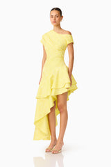Brunette Model wearing Luella Asymmetrical Gown in Yellow slight side shot