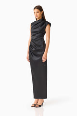 Brunette model wearing the Coralie Maxi Gown in Black side shot 
