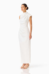 Brunette model wearing the Coralie Maxi Gown in Pearl White side shot 