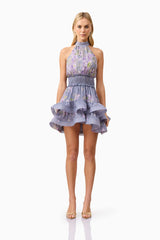 Blonde model wearing Milena Halter Mini Dress in Purple Floral front shot
