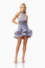 Blonde model wearing Milena Halter Mini Dress in Purple Floral posed shot