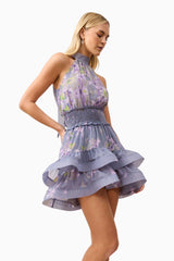 Blonde model wearing Milena Halter Mini Dress in Purple Floral close up shot