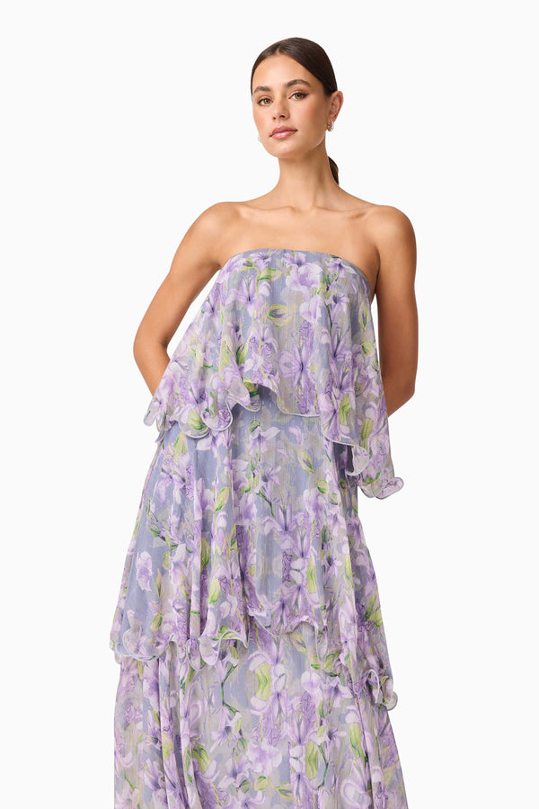 Brunette model wearing Milena Strapless Maxi Dress in Purple Floral close up shot