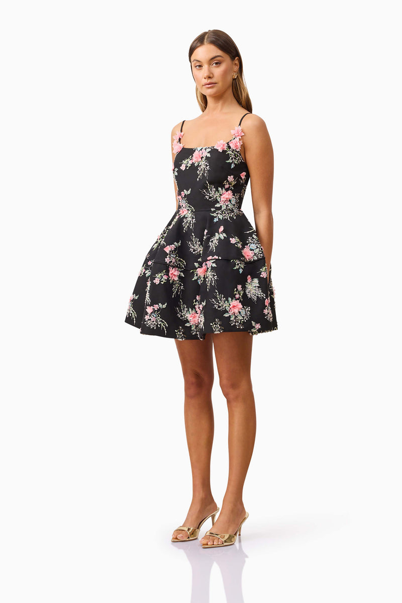 Brunette model wearing Gaia Floral Mini Dress in Black side shot