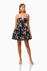 Brunette model wearing Gaia Floral Mini Dress in Black posed shot