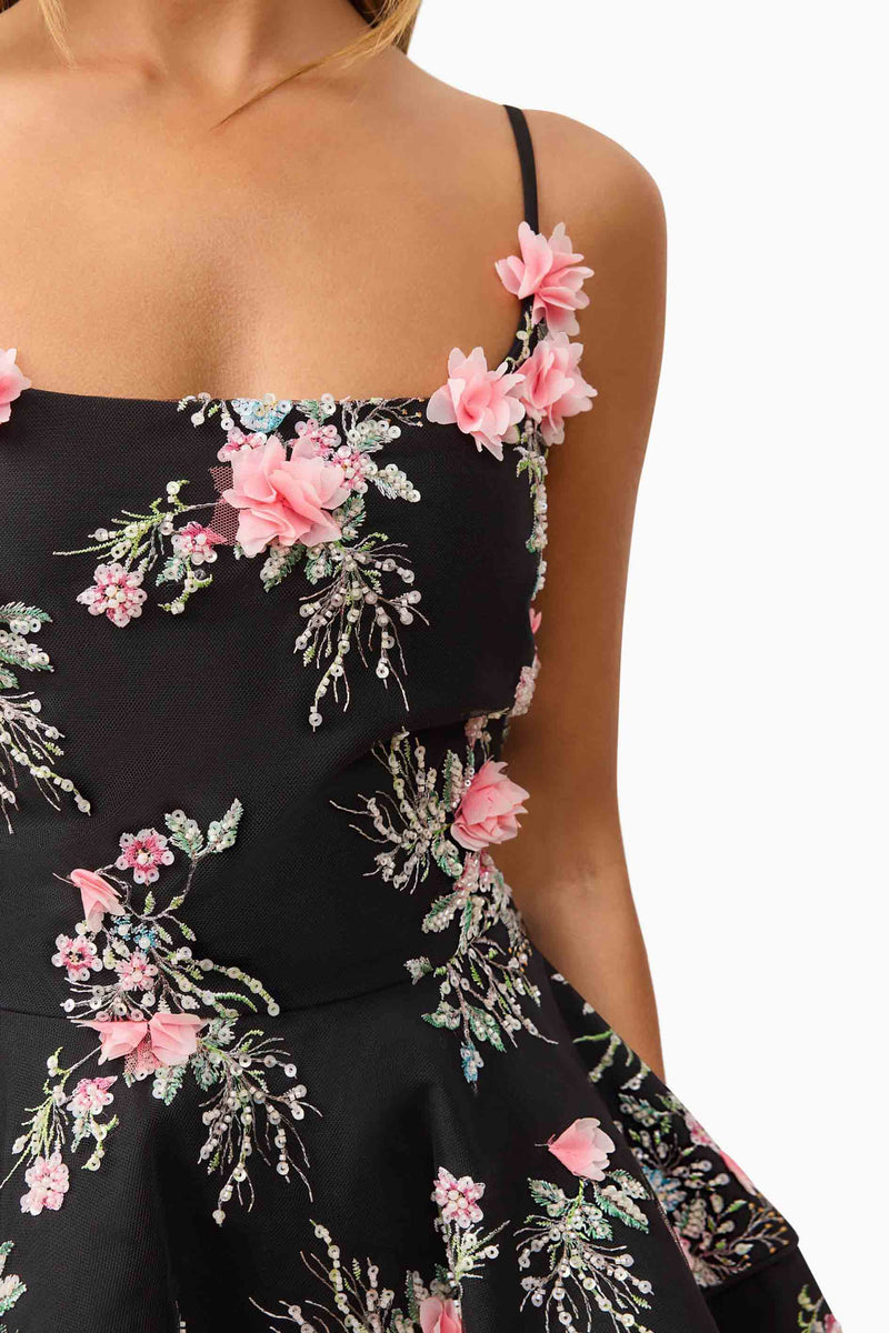 Brunette model wearing Gaia Floral Mini Dress in Black detail shot