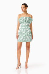 Lisette Ruffle Mini Dress in Sea Green with jacquard fabrication and structured ruffle bust posed looking away shot
