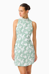 Lisette High Neck Mini Dress in Sea Green with jacquard fabrication and shift dress style close up looking away shot