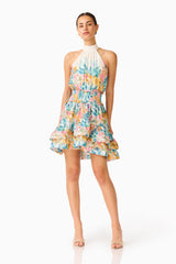 Clementina Halter Mini Dress in Multi Floral with a tiered skirt and printed georgette fabrication posed shot