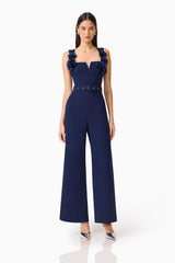 Leonara Sleeveless Jumpsuit in Deep Navy with floral appliques and a belt posed shot