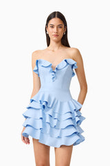 Brunette model wearing the Liora Strapless Tiered Mini Dress in Sky Blue close up shot