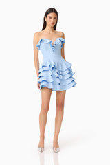 Brunette model wearing the Liora Strapless Tiered Mini Dress in Sky Blue posed shot