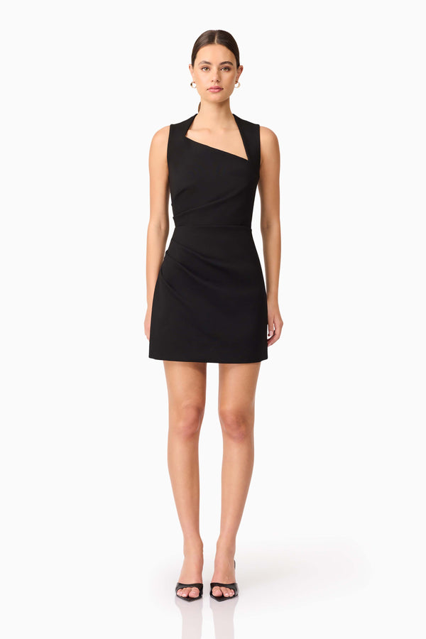 Brunette model wearing Alina Asymmetrical Mini Dress in Black front shot