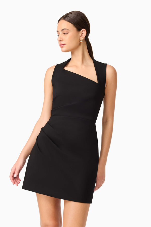 Brunette model wearing Alina Asymmetrical Mini Dress in Black posed shot